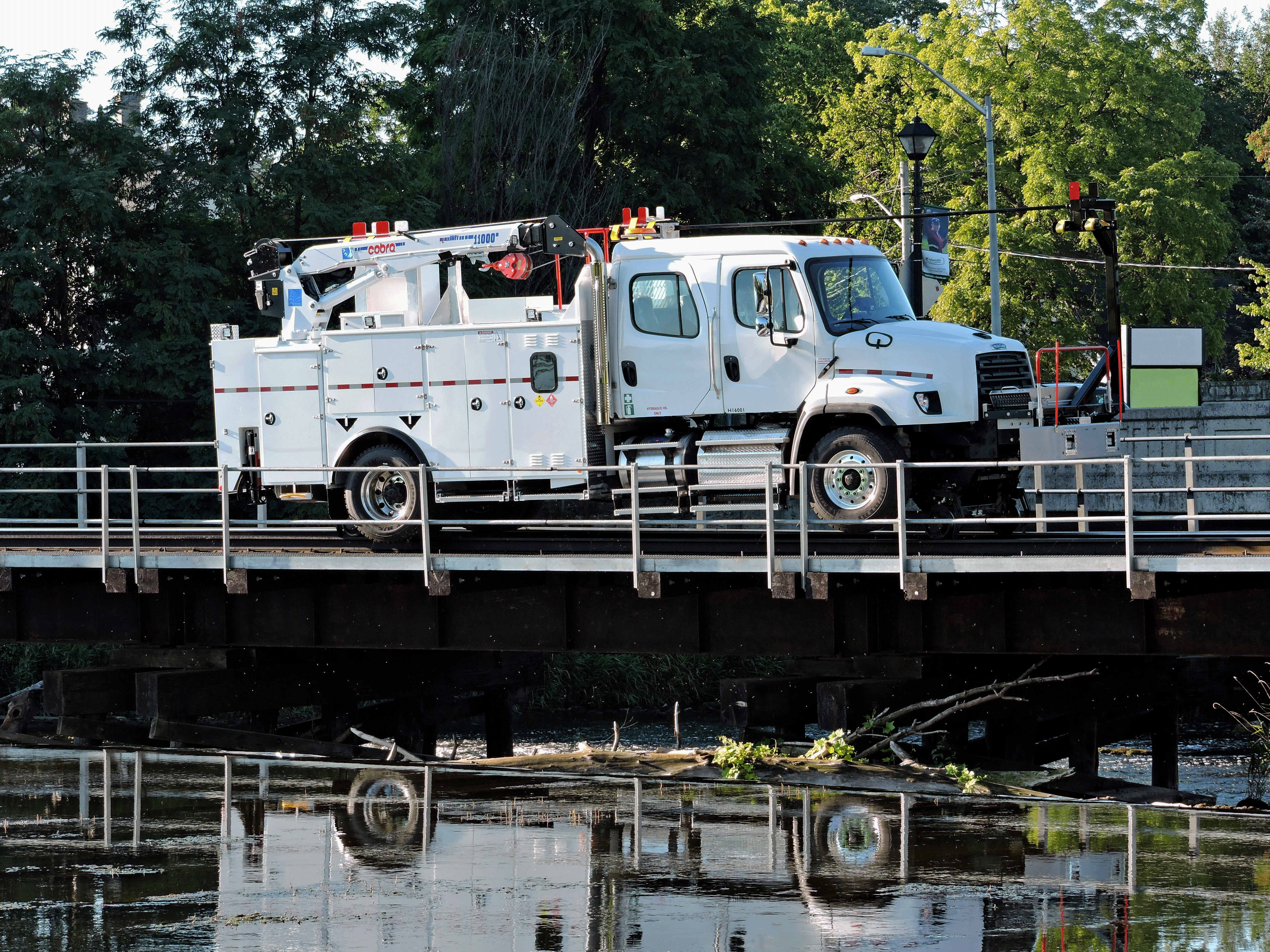 truck with crane on bridge