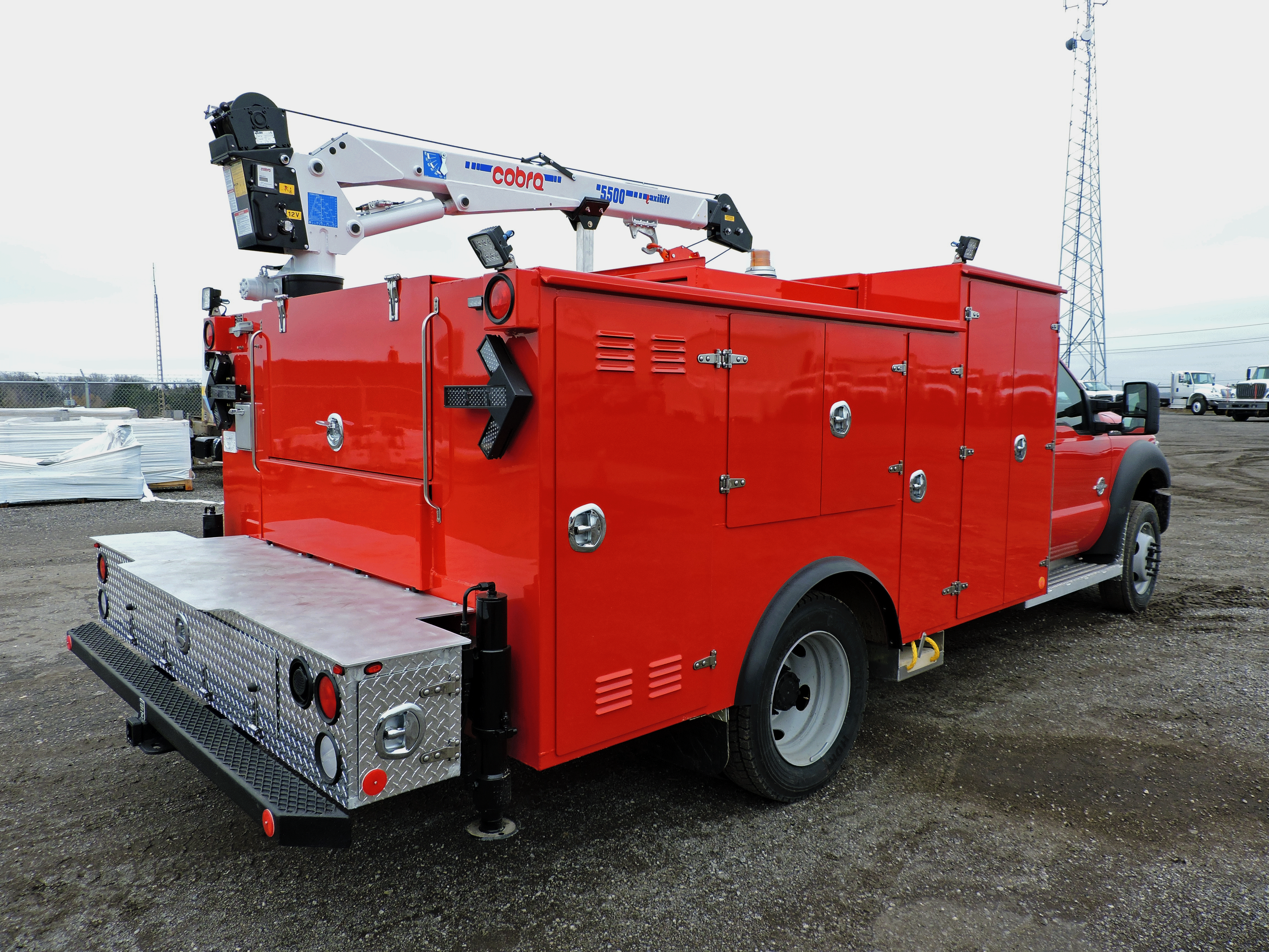 rear and right side view of red truck