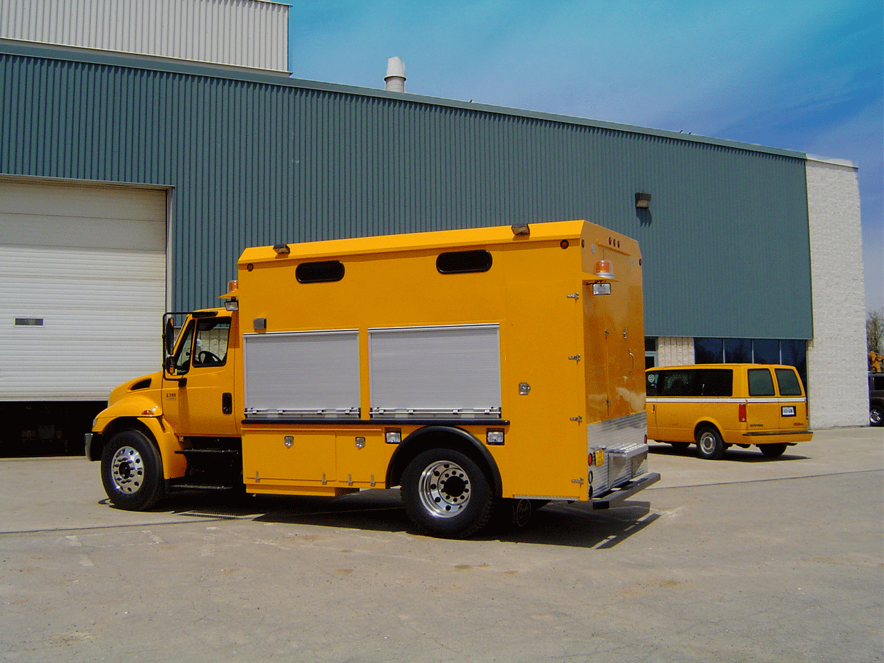yellow truck and van